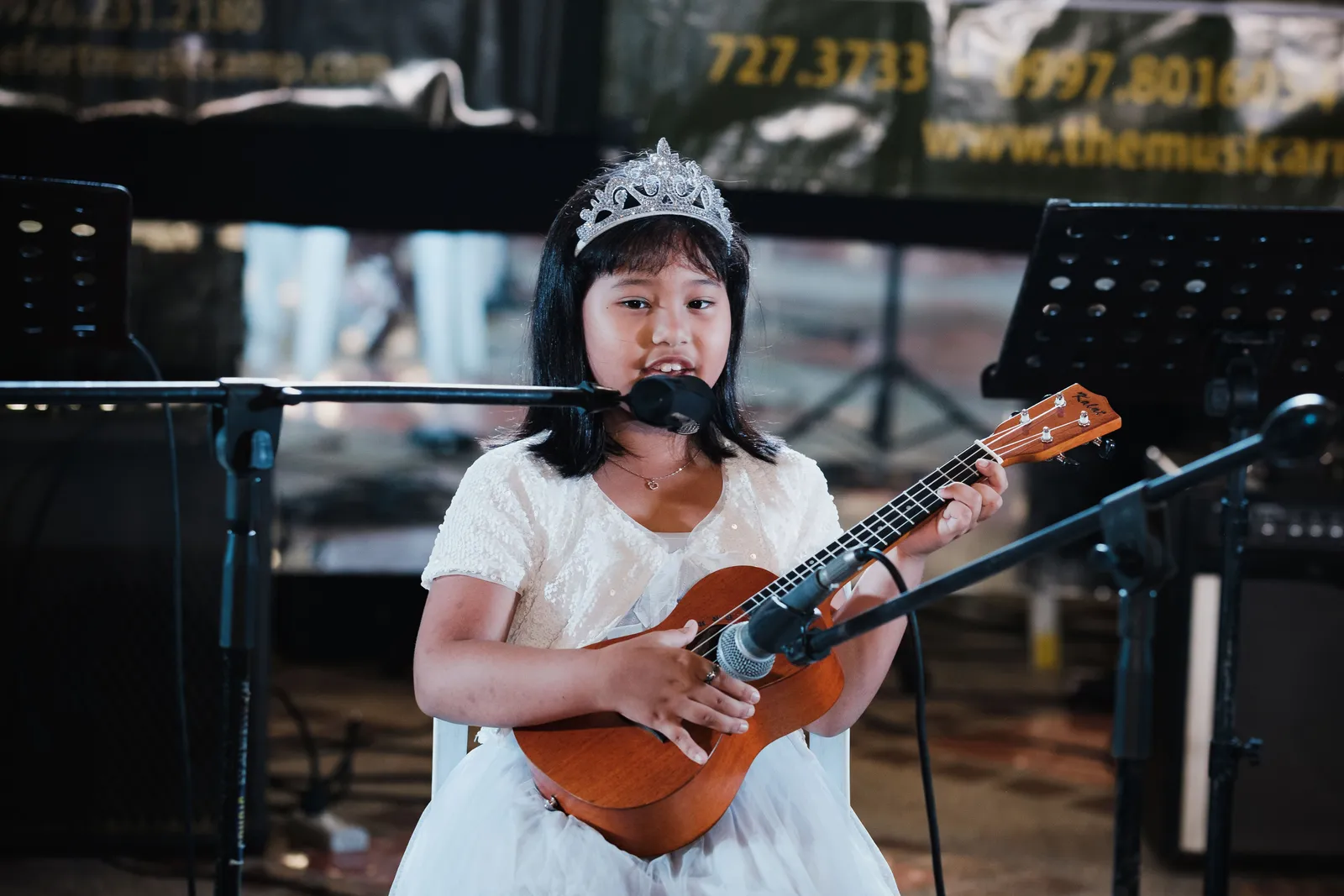 A student playing ukulele